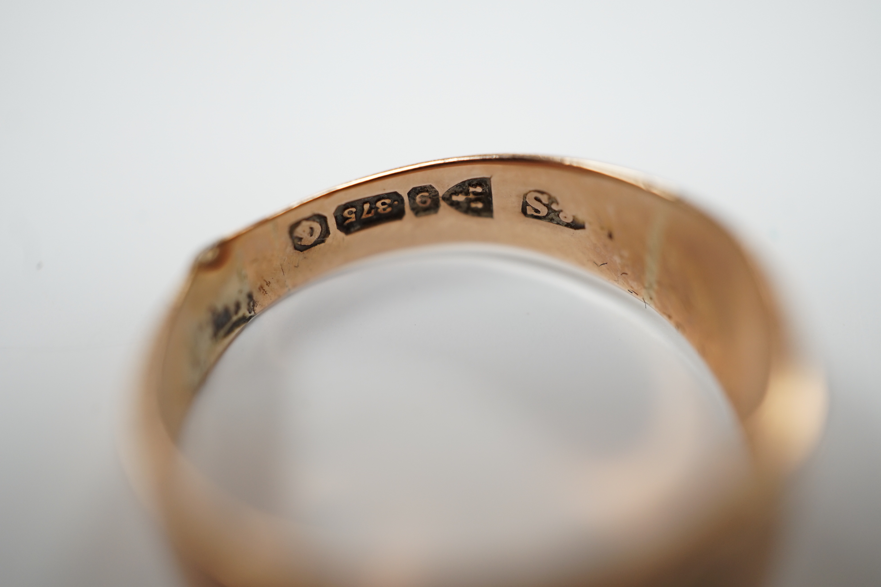 A 9ct gold and diamond chip set signet ring, size R, gross weight 3.7 grams.